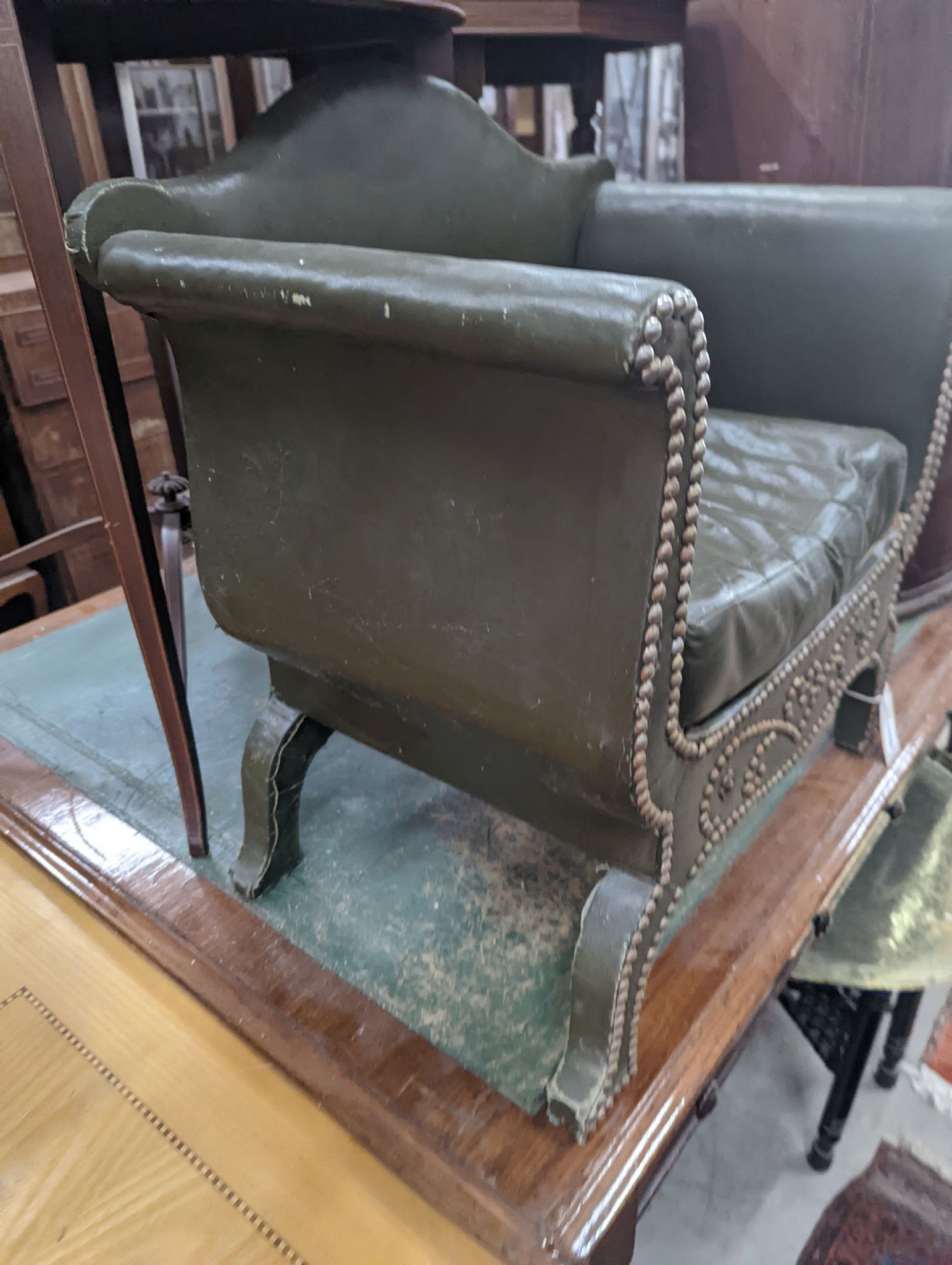 A small green faux leather dog bed, width 58cm, depth 37cm, height 60cm